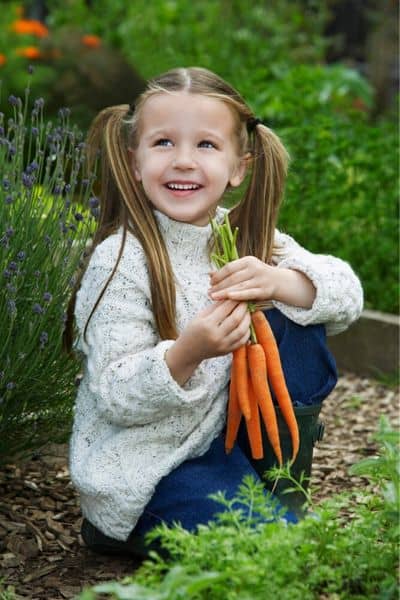 girl picking carrots