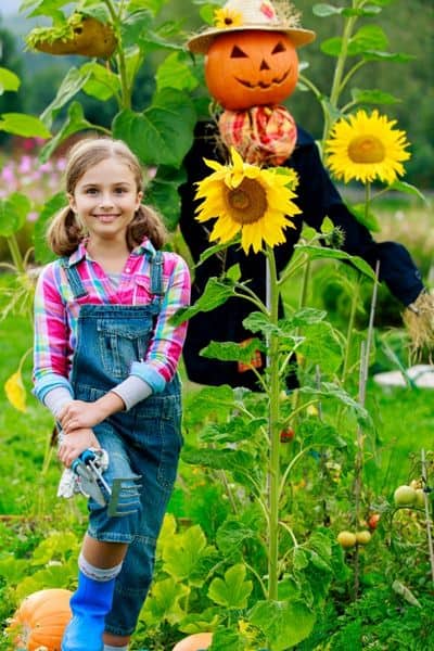 girl growing sunflowers